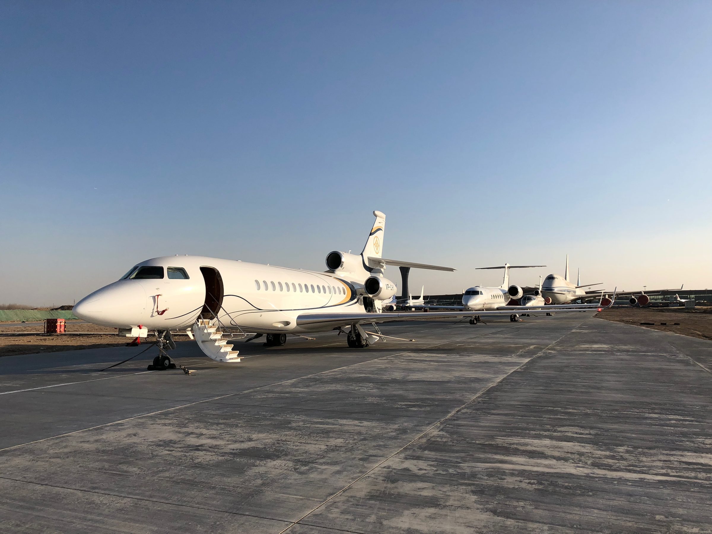 Row of Falcons on the apron at golden hour